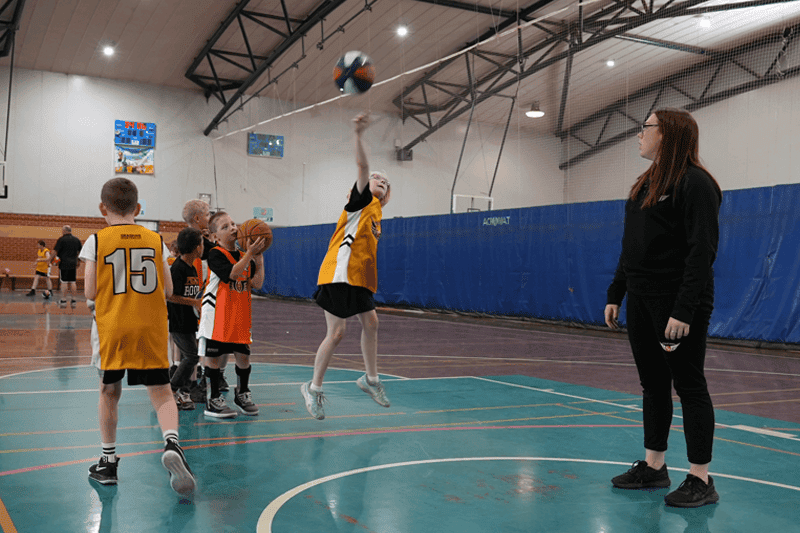 Emily Attard teaching basketball