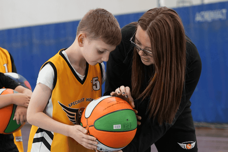 Emily Attard teaching basketball