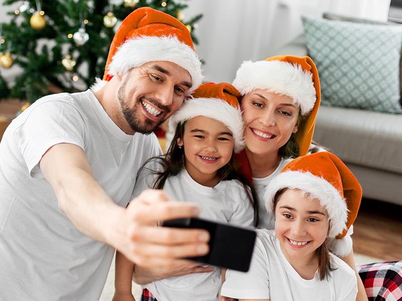 Family taking christmas selfie