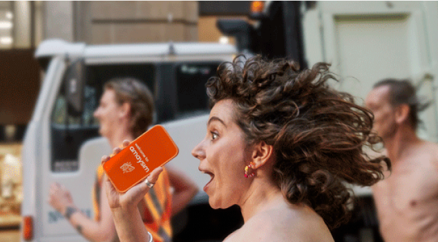 new cvp nudie run phone woman in profile running down street with mobile phone in hand that has the amaysim app on it